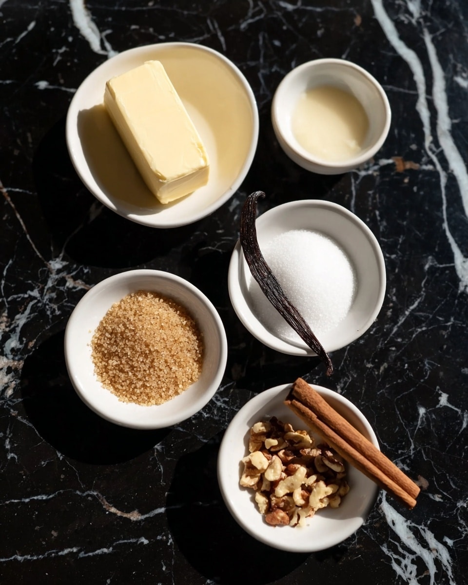 Five white small bowls are placed on a black marbled surface with white veins. One bowl holds a rectangular block of pale yellow butter, another is filled with light brown sugar granules, and a third has white granulated sugar. A fourth bowl contains a small amount of pale liquid with a dark brown vanilla bean pod lying inside. The fifth bowl holds a mix of light brown cinnamon powder, small chopped nuts, and a whole cinnamon stick resting on top. The lighting highlights the smooth and granular textures clearly, photo taken with an iphone --ar 4:5 --v 7