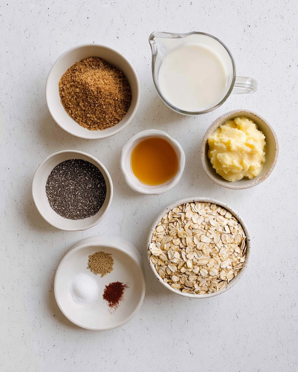The image shows seven small white bowls and a measuring cup on a white marbled surface. From top left going clockwise, there is a small round bowl filled with brown sugar, a clear glass measuring cup with milk, a small rounded bowl with mashed banana, a tiny round bowl with amber liquid, a rounded bowl with black chia seeds, a small divided plate with white salt, brown spice, and white sugar, and a larger bowl centered with pale rolled oats. The arrangement is neat and evenly spaced, with a clean and bright look. Photo taken with an iphone --ar 4:5 --v 7