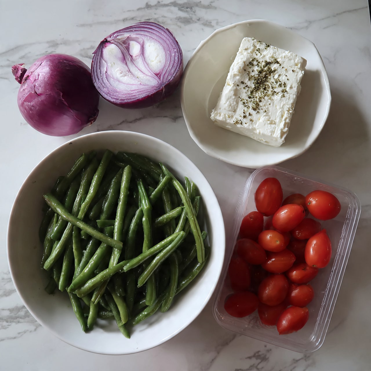 A white bowl filled with a colorful salad made of bright green cut green beans, red cherry tomato halves, thin slices of purple-red onion, and small white crumbles of cheese scattered on top. A silver fork is stuck into the salad, lifting some beans, a tomato half, and onion slices. The salad looks fresh and lightly dressed, with a shiny texture on the vegetables. The bowl sits on a white marbled surface. Photo taken with an iphone --ar 4:5 --v 7