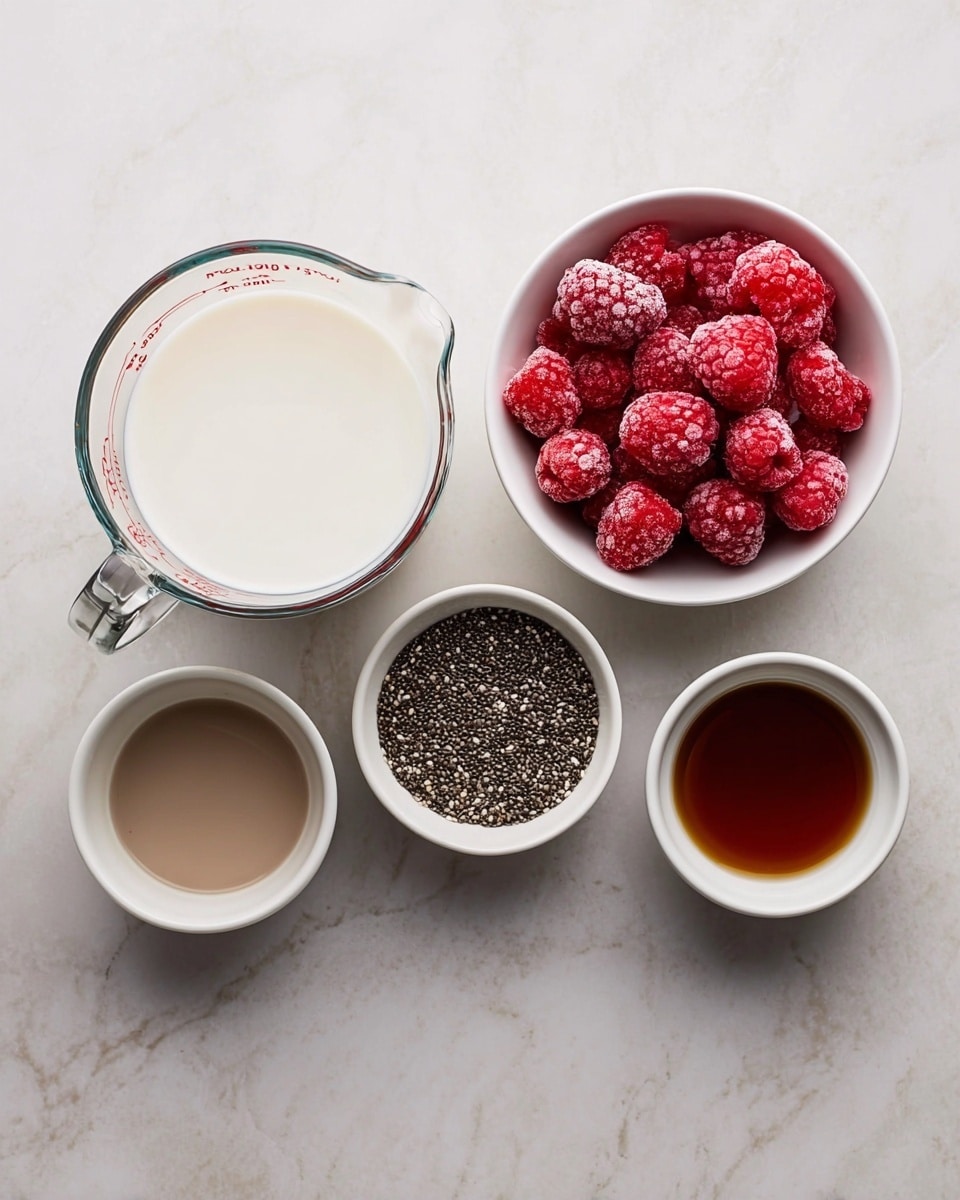The image shows five containers on a white marbled surface. On the left, there is a clear glass measuring cup filled with white milk. To the right of it, there are four small white bowls arranged in a loose square shape. The top left bowl contains a light brown liquid, the top right bowl holds bright red frozen raspberries with a frosty texture, the bottom left bowl is filled with small black and white chia seeds, and the bottom right bowl contains a darker brown liquid. Photo taken with an iphone --ar 4:5 --v 7