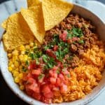 Doritos Taco Bowl with Ground Beef, Rice, and Fresh Toppings Recipe